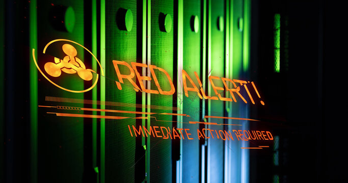 Image of red alert text and symbol over server room