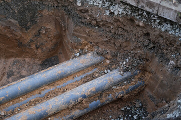 old pipes for sewerage, water supply, concept of repairing urban communications, conducting...