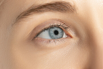 Close-up image of beautiful blue female eye. Laser vision correction. Concept of health, medicine, surgery