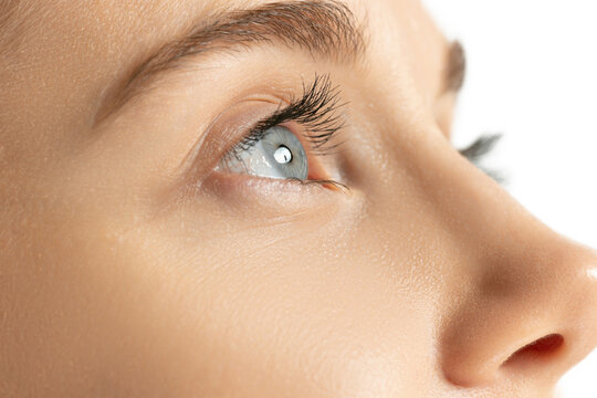 Close-up image of beautiful blue female eye. Laser vision correction. Concept of health, medicine, surgery