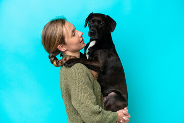 Young caucasian woman with her dog over isolated background