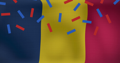 Image of confetti over flag of romania