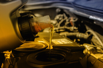 Refueling and pouring oil quality into the engine motor car Transmission and Maintenance Gear .