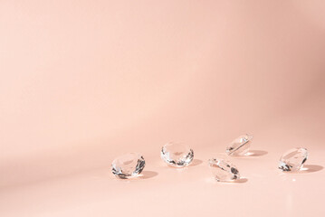 Pink background for product presentation with diamonds. Minimal concept and hard sunlight.