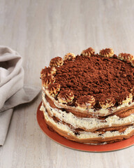 Whole Tiramisu Cake on Marble Table.