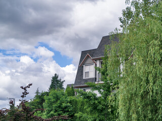Top of residential building with window on the roof