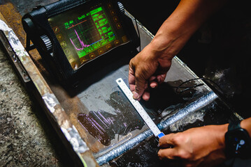UT, Ultrasonic testing to detect imperfection or defect in welding of steel structure outside. NDT...