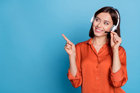 Portrait of attractive trendy cheerful girl help desk service showing copy space isolated over bright blue color background
