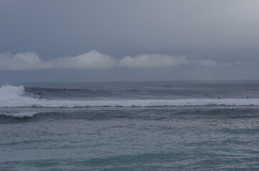 Naklejka premium Surfers at Ujung Bocur