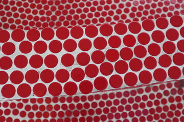 red background of mini circle red tiles
