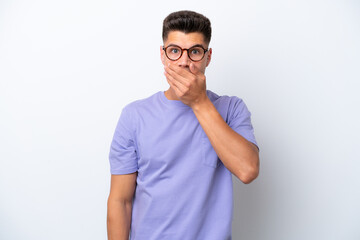 Fototapeta premium Young caucasian man isolated on white background covering mouth with hand