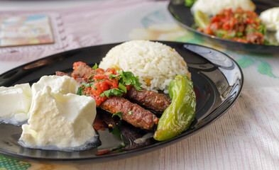 Delicious Turkish Traditional Manisa Kebap, Tire Kofte serving on metal plate