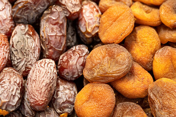 Dates fruit and dried apricots. healthy foods. Close-up.