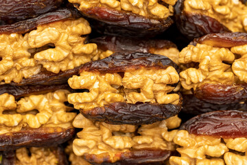Walnut date fruit. Walnut filled dates healthy food. Close-up. local name cevizli hurma