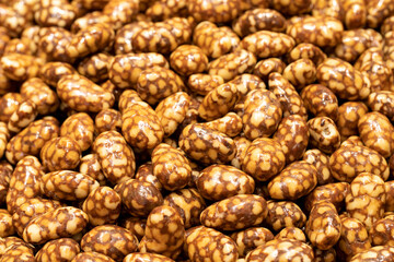 Honey hazelnut dragee. Honey filled dragee. nut dragee. Sweet snack. close up