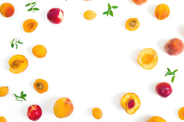 Summer fruits - ripe apricot and peaches with mint leaves on white background. Flat lay.