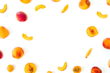 Sliced peaches fruits on white table. Top view. Flat lay