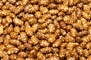 Honey hazelnut dragee. Honey filled dragee. nut dragee. Sweet snack. close up