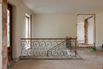 Entrance of an old villa undergoing demolition and renovation