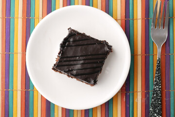 slice of brownie on plate on table 