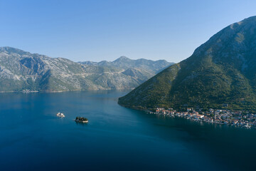 Naklejka premium Aerial view of coastal town of Perast and two small islets in sea, Montenegro