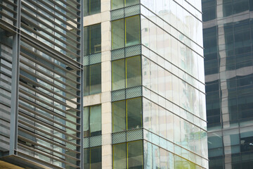 Obraz premium detail shot of modern glass buildings in dhaka city 