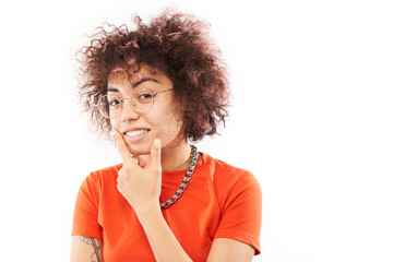 Funny curly girl holding her chin thinks doubts, makes decision isolated on white studio background - obrazy, fototapety, plakaty