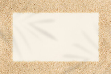 A square-shaped frame made of sand of fonio millet grain on a pastel beige background with copy space. Minimal card note holiday seaside outdoor idea. Nature inspired summer vacation beach flat lay.
