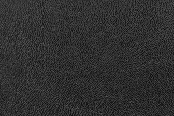 Black leather background texture for designers.black skin. black background texture with pattern. Textured surface of dark skin product