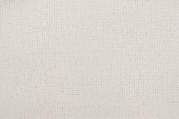 White natural texture of knitted wool textile material background. White cotton fabric woven canvas texture