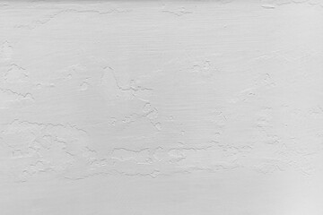 white wall with pieces of peeling plaster background texture