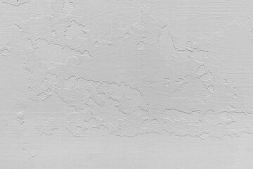 white wall with pieces of peeling plaster background texture