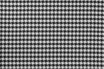 White black textile cloth texture background. shirt fabric with a checkered pattern. factory...