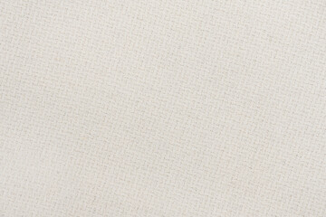 White natural texture of knitted wool textile material background. White cotton fabric woven canvas texture