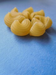 pasta close-up, blue texture background, copy space, wallpaper