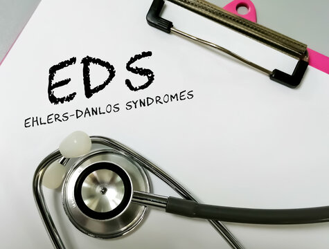 Ehlers-Danlos syndrome term on white background with stethoscope. rare disease.