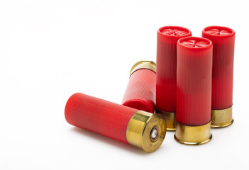 Red shotgun bullet shells on white background , Gun shooting game - obrazy, fototapety, plakaty
