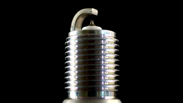 Close-up. Automotive spark plug with thin iridium electrode