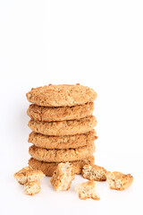Oatmeal, fig, hazelnut, pistachio and sesame cookies on a white background. Enjoyable snack.
