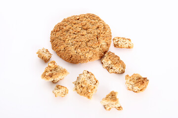 Oatmeal, fig, hazelnut, pistachio and sesame cookies on a white background. Enjoyable snack.