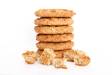 Oatmeal, fig, hazelnut, pistachio and sesame cookies on a white background. Enjoyable snack.
