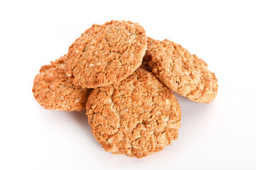 Oatmeal, fig, hazelnut, pistachio and sesame cookies on a white background. Enjoyable snack.