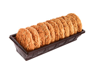 Oatmeal, fig, hazelnut, pistachio and sesame cookies on a white background. Enjoyable snack.