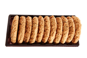 Oatmeal, fig, hazelnut, pistachio and sesame cookies on a white background. Enjoyable snack.