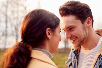Loving Transgender Couple Enjoying Walk In Autumn Or Winter Countryside