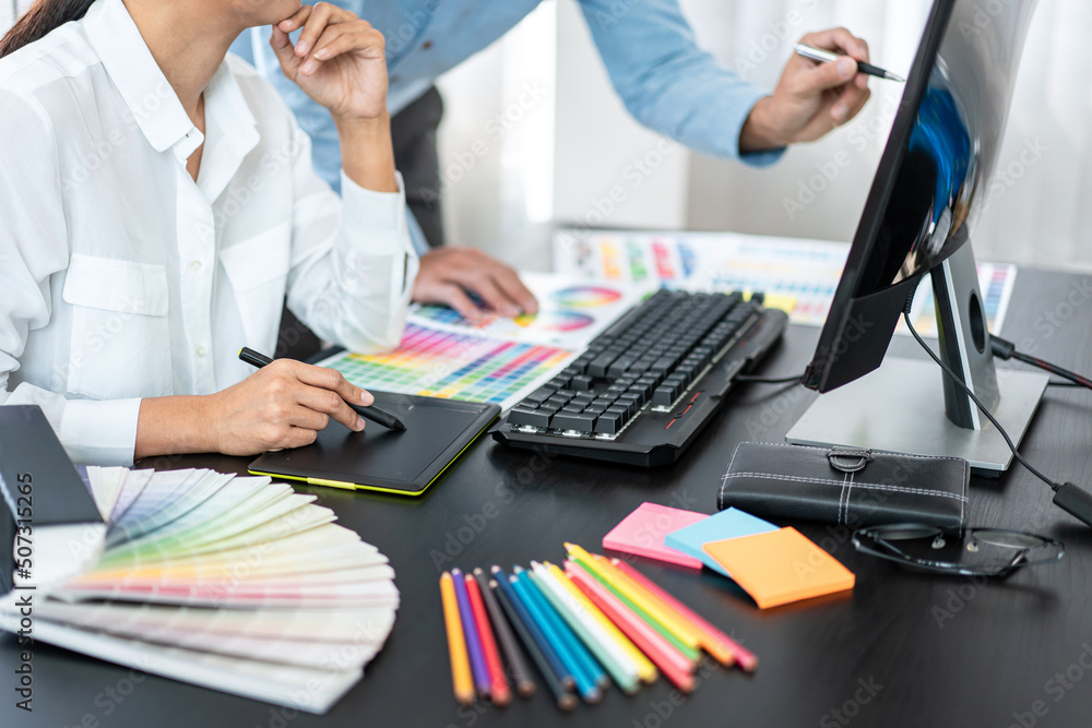 Aufkleber Team of creative graphic designer working on color swatch samples chart for selection coloring in inspiration to create new collection at workplace