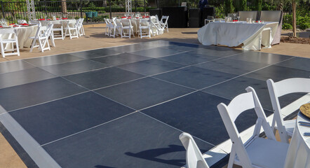 View of a modular dance floor at a wedding reception. Party rental equipment.
