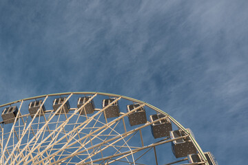 .photograph of a ferris wheel from below against the sky
