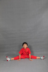 little boy fashion Smiling child in red chinese dress, style and fashion ideas for children.