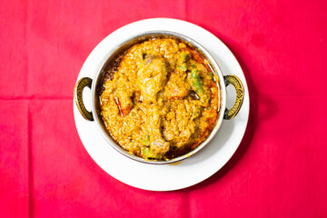 Chicken karahi, indian spicy chicken masala isolated on background top view of pakistani chic